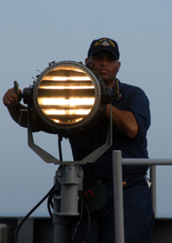 Naval signal lamp and operator