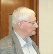 A profile view of a white-haired, bespectacled Bill Learmonth, G4YZE, looking towards the right of the photograph