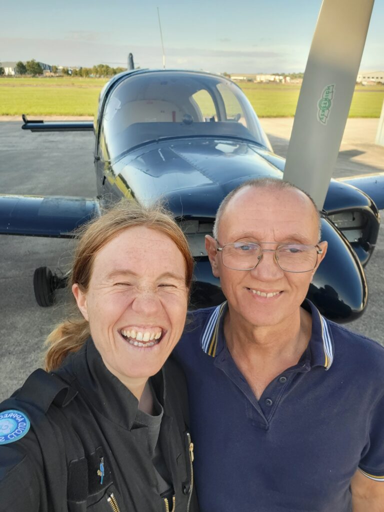 Amy and Nick beside the aircraft