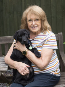 Former volunteer Davina Williams, M0LXT pictured with her latest puppy in training