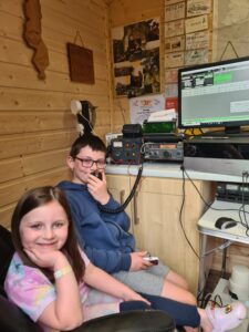 Alfie and Penny pictured in their Grandad's shack 