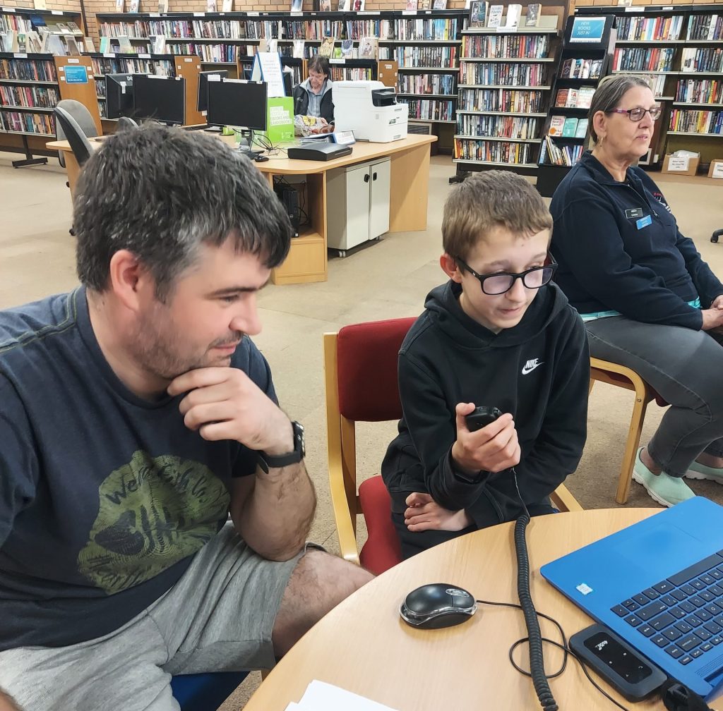  Jack, 14, makes QSO under supervision at library open event